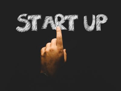 Image of finger pointing at the phrase start up