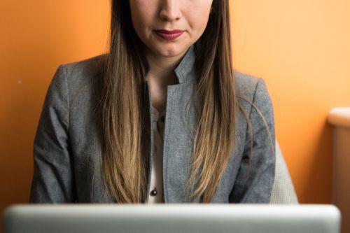 photo of an Asian woman in front of a computer