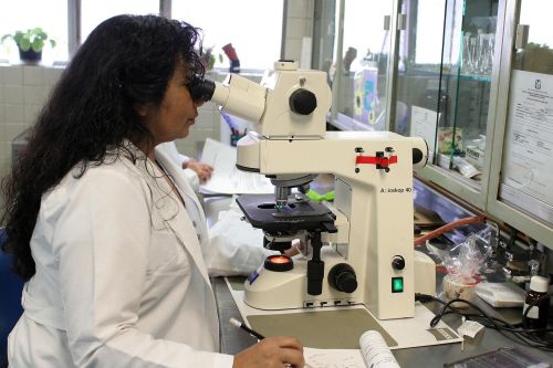 photo of a woman at a microscope