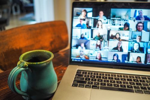 photo of a laptop with Zoom windows