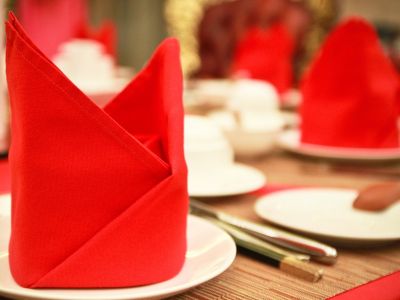 Photo of Red Napkins on a Set Dinner Table