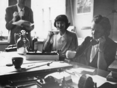 Rachel Carson and Katherine Howe sitting in Howe and S. Briggs' office. Interior, taken during the late 1940's.