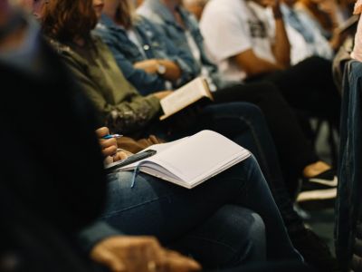 Image of people reading in a classroom.