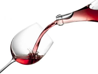 Photo of wine being poured into a glass.