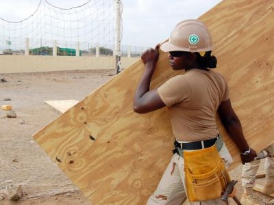 Image of woman working on a construction project.