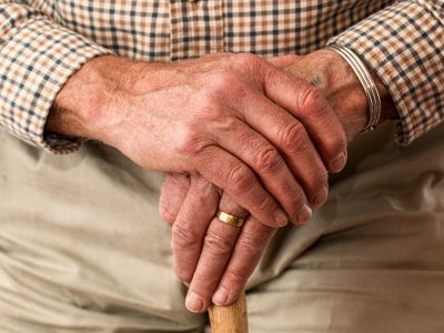 Photo of elderly person with walking stick