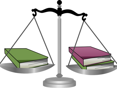 Image of weighted scale balancing books