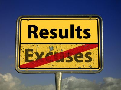 Photo of Sign Saying Results and Excuses