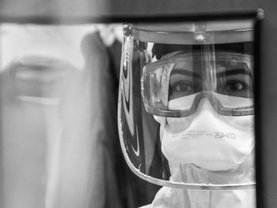 Image of woman wearing PPE.