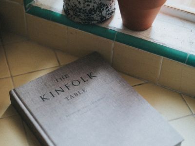 Photo of book near a cactus