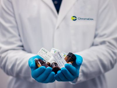 Photo of Scientist Holding Patient Samples