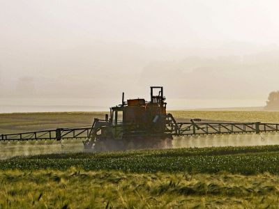 Image of pesticides being sprayed on a field