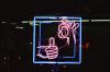 photo of a neon sign giving a thumbs up and an okay sign